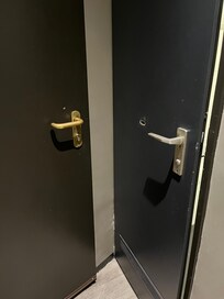 Bathroom door on right doesn't open fully because it hits entrance door. See damage.