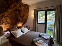 The master bedroom with the large rock! We kept the door open to the backyard at night for the cool fresh air!