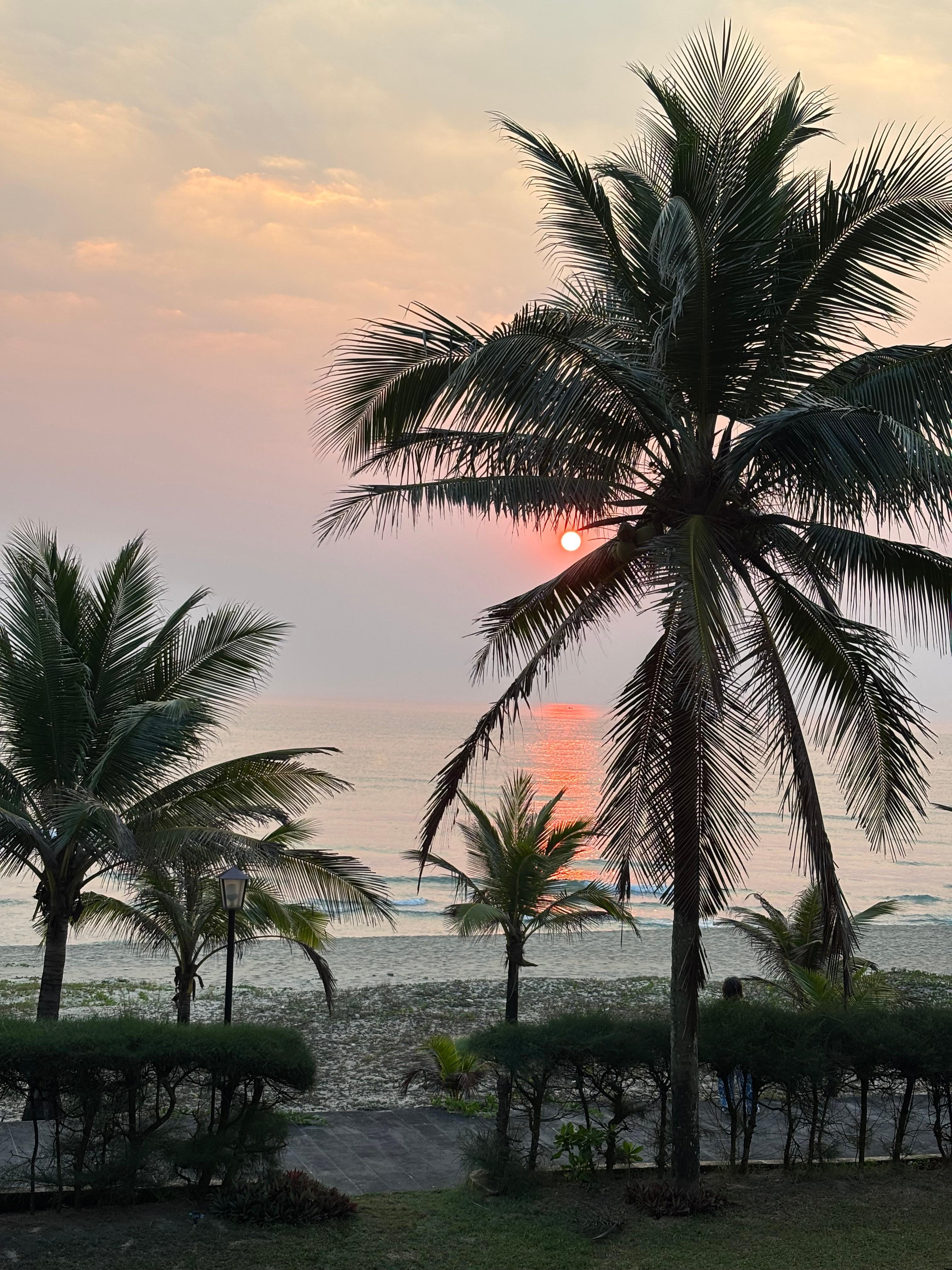 Watching the sunrise over the ocean from the room with balcony - ocean view.
