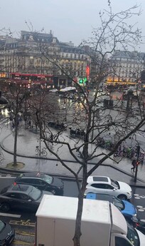 Window view, loved hearing the giant windows getting fresh air and hearing activity below but super quiet when you closed the windows.