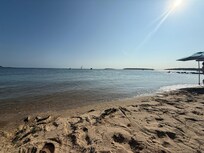 Bayside “Mayo Beach” is just past town with ample free public parking immediately adjacent to the sand. Great for small kids and accessible for older folks and people with health or orthopedic issues. Also faces the sun better than the ocean side.