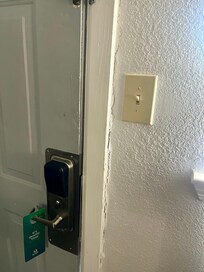 Evidence that the door had been kicked in previously.