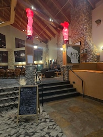 Entry stairs to dining area. Chalk board messy and not clear writing. Poor presentation