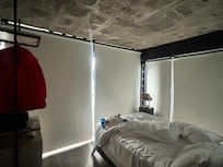 Room with excellent views but windows need to be insulated as well as window treatments to keep heat out.