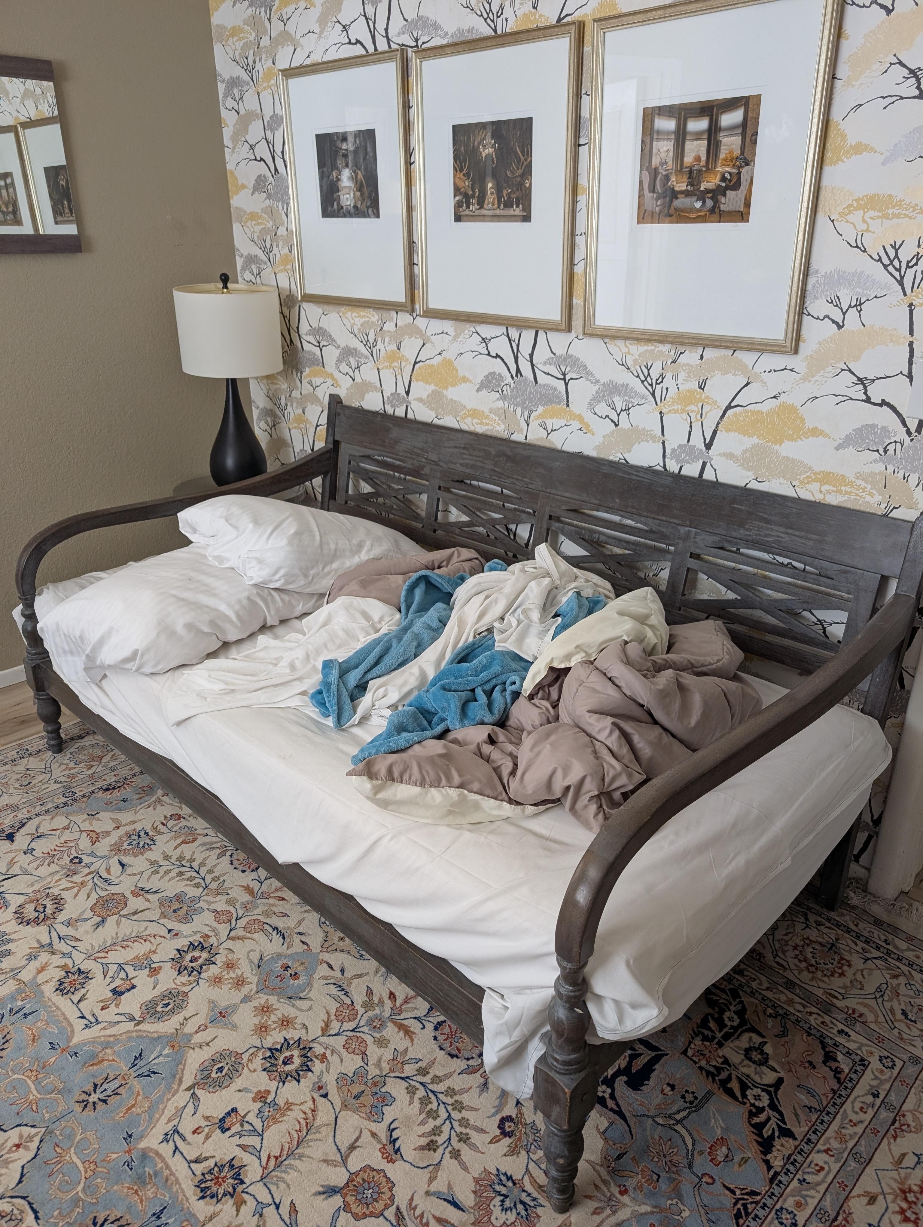This is a twin bed - you can tell by the overlapping pillow. No way you can fit two adults in this bed.