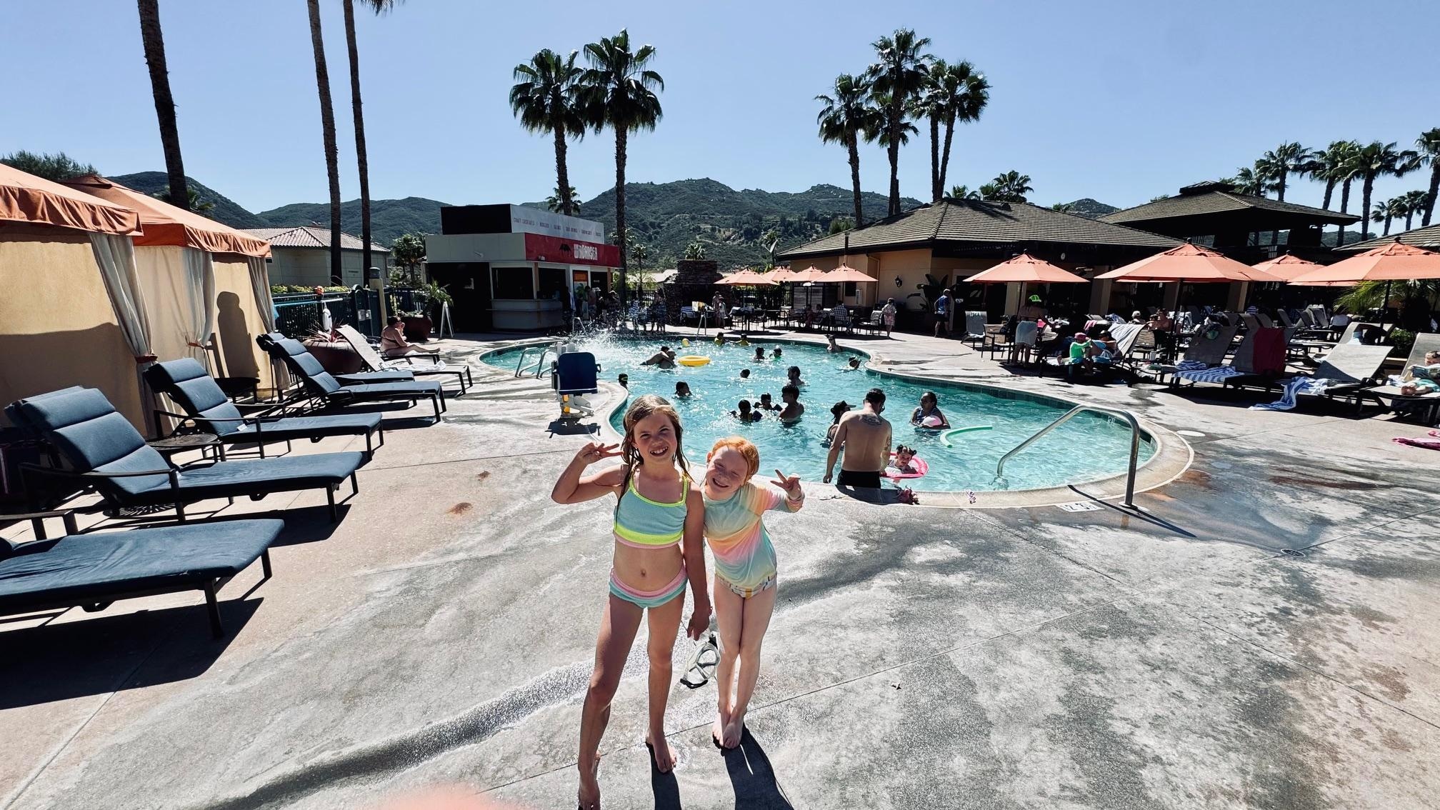 this main pool area in the center of the resort has 2 pools, a hot tub, the waterslides, a kid splash pad, a playground, an indoor game area and a place to order food and drinks.  Along with 7 different cabanas for renting.