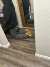 Maintenance guy getting ready to kick down the bathroom door to get my little son out