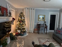 Living room beautiful decor and a warm and bright Christmas tree.