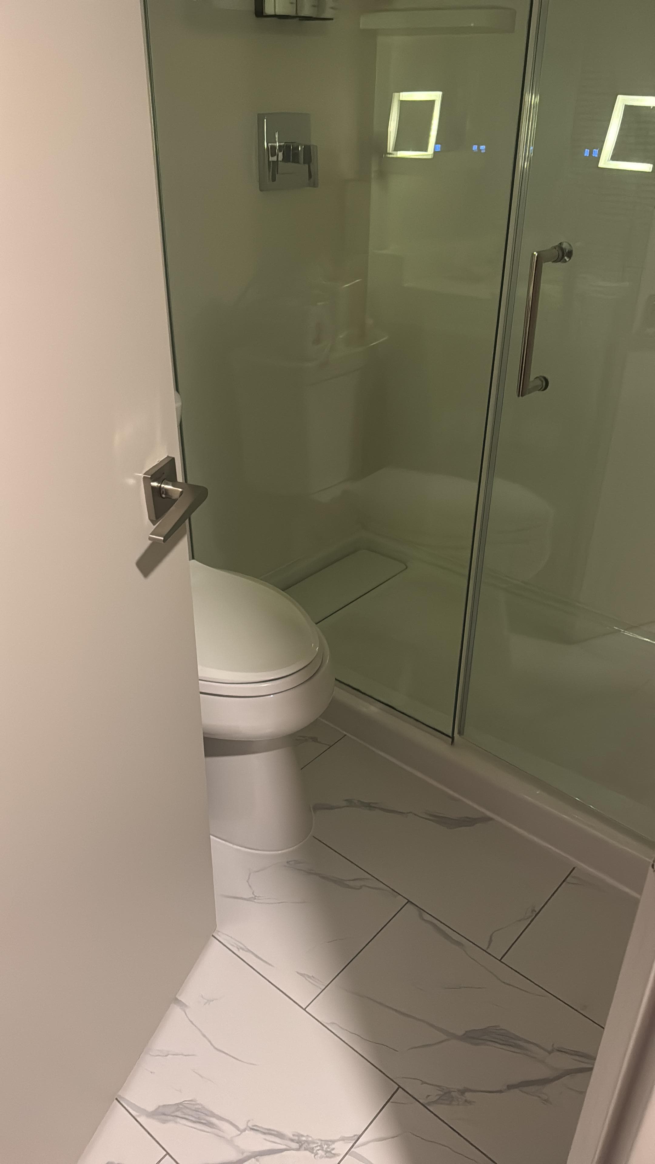 Bathroom, sink blocked with door open
