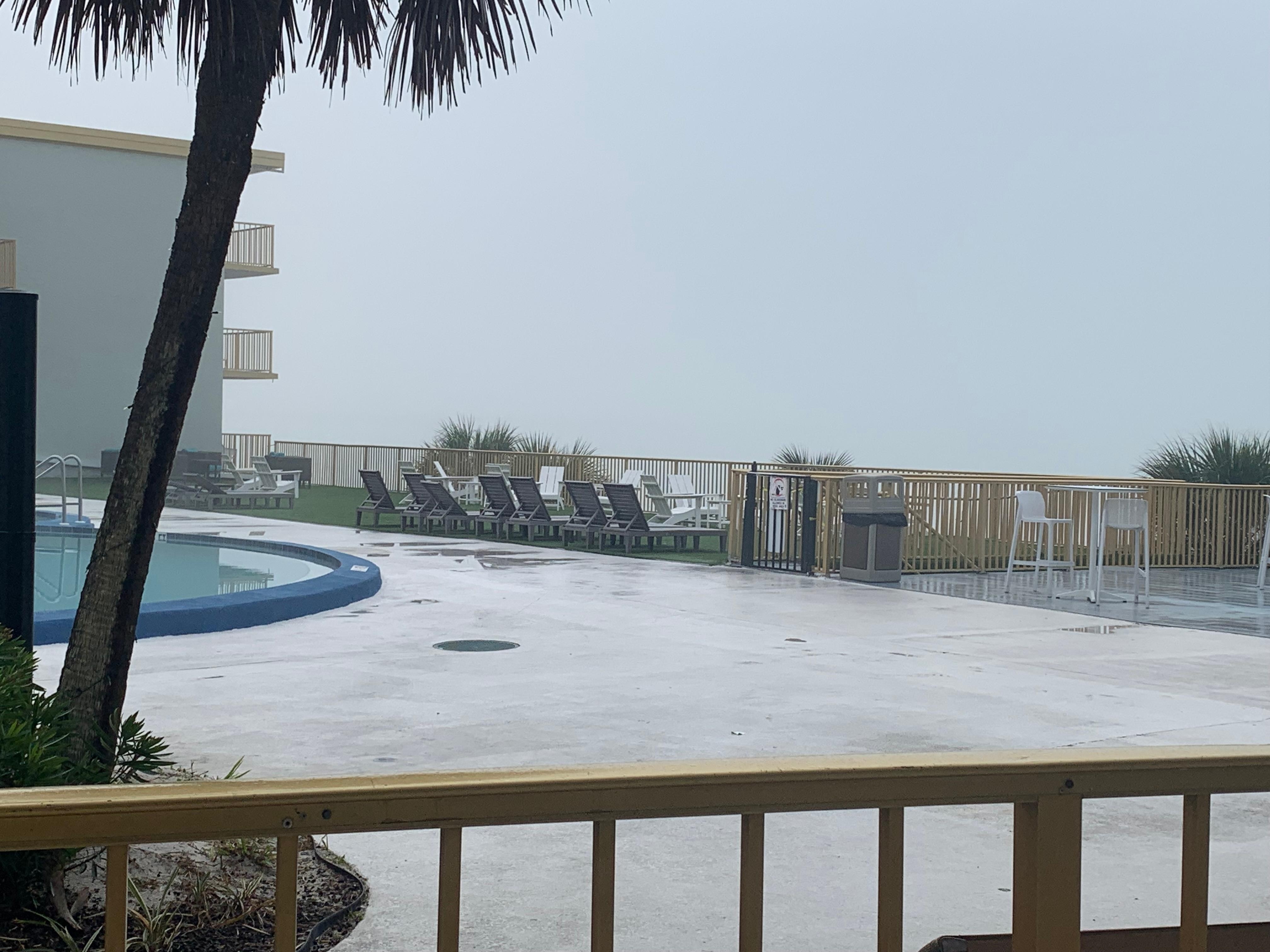 Pool and beach view from room on floor 2. Would have seen the Gulf, if not for the fog.