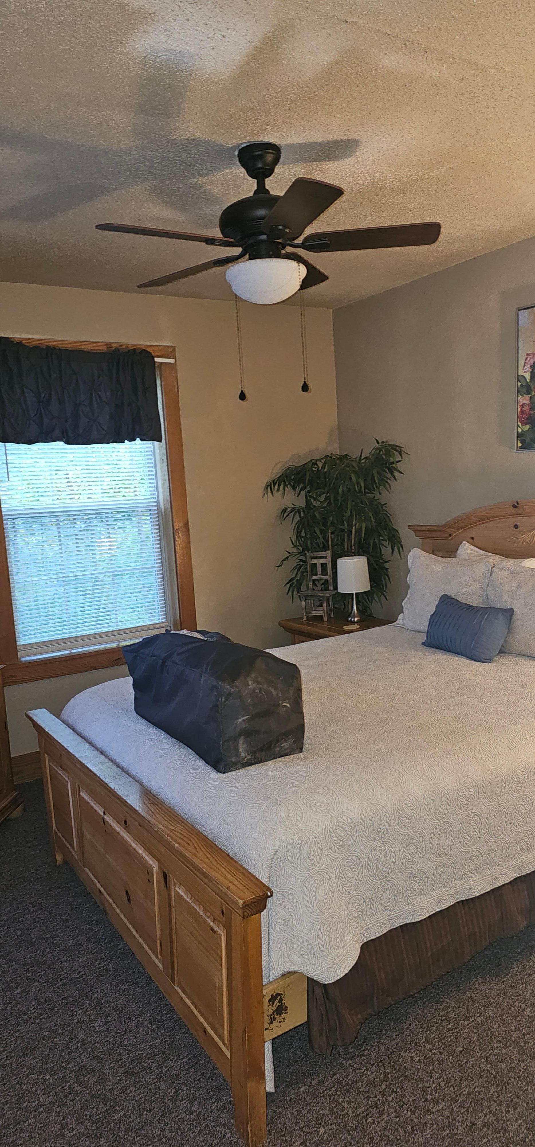 Master bedroom with a very comfortable bed.