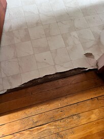 Peeling bathroom floor