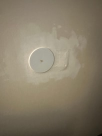 Wall repaired but not painted.