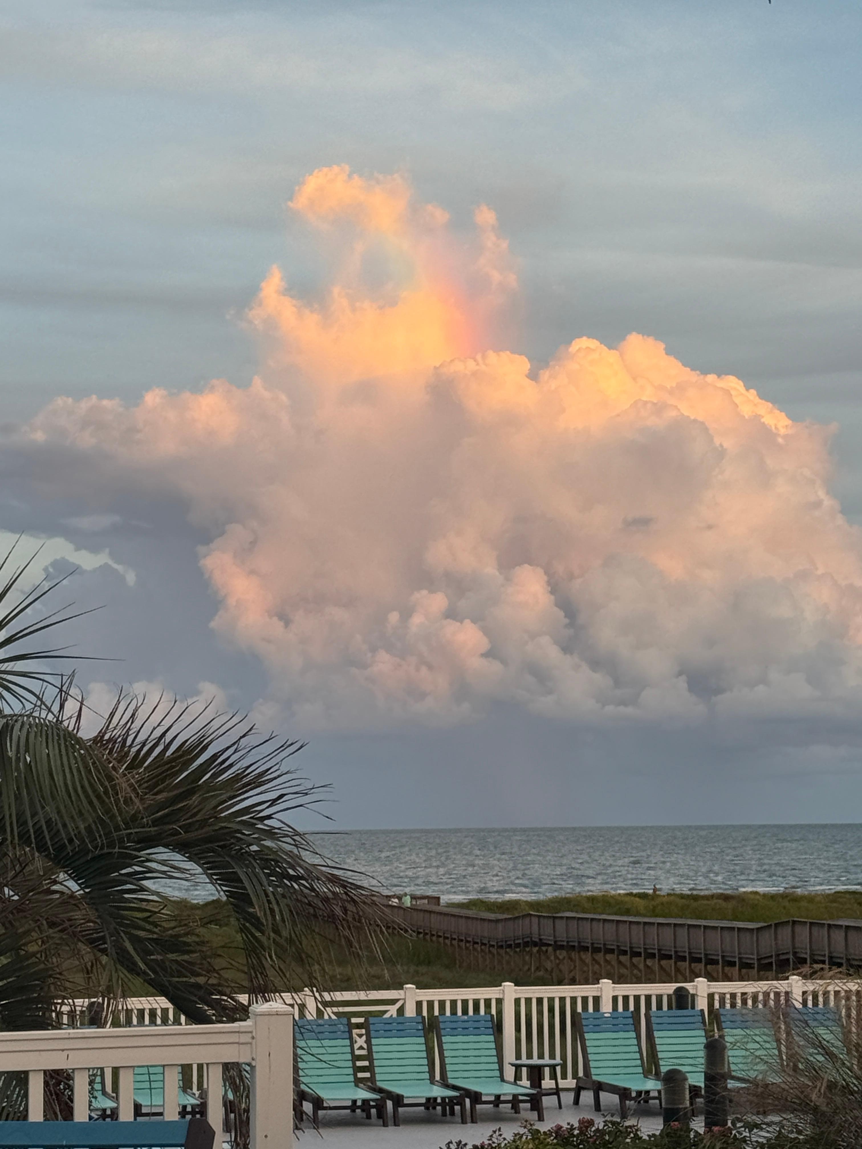 Beautiful evening sky with prism rainbow 