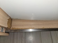 Inside cabinet where the refrigerator is