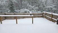 Lots of snow. View of backyard.