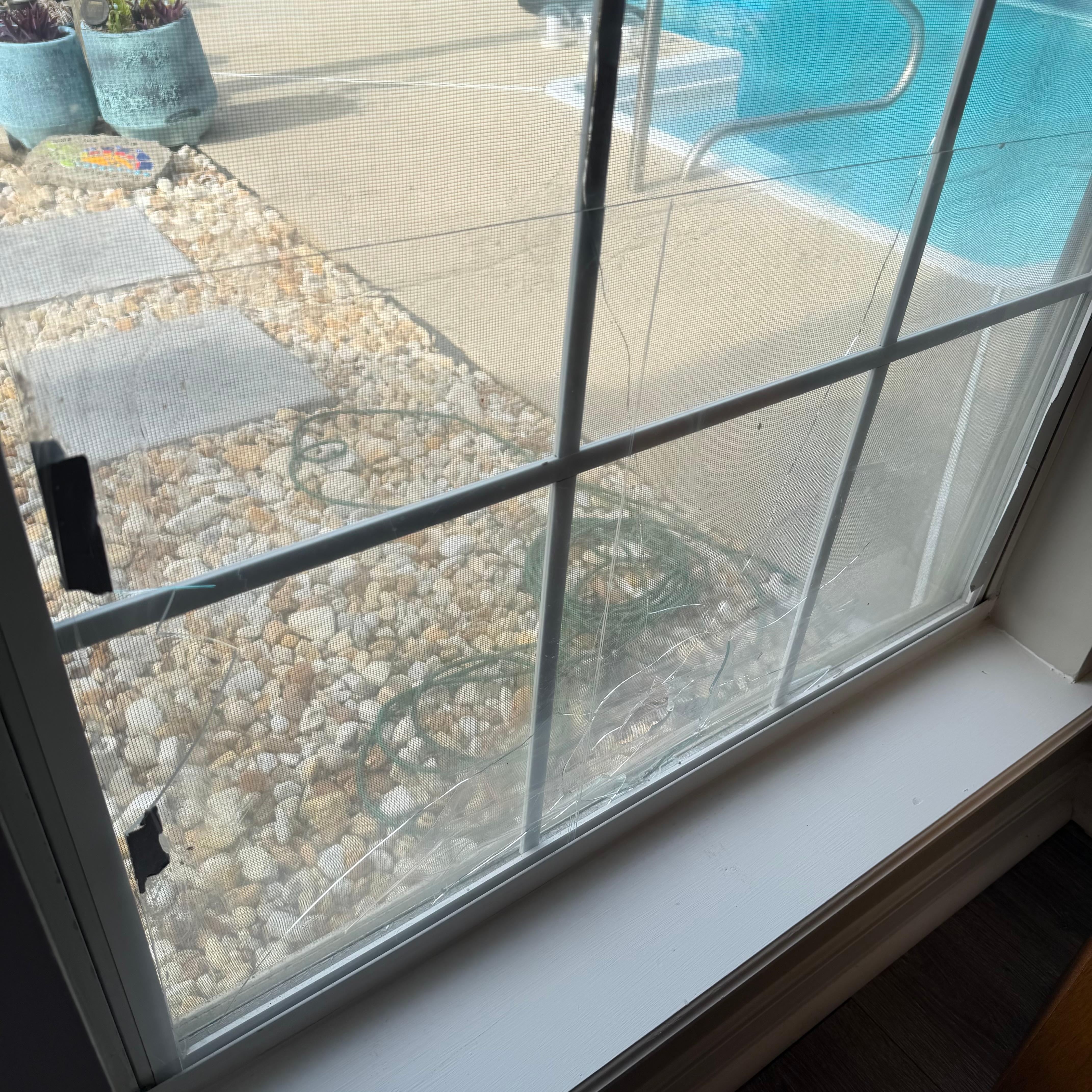 Cracked window with bandaid of plexiglass 