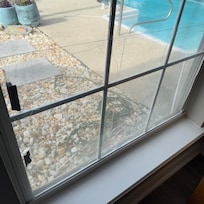 Cracked window with bandaid of plexiglass