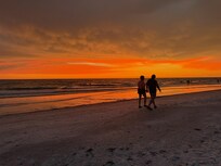 We enjoyed the beautiful and breathtaking sunsets.
Someone walking on the beach saw us holding hands and walking along the shore and snapped this photo of us. They stopped us and wanted to share it with us. We were so thrilled to get this picture!!