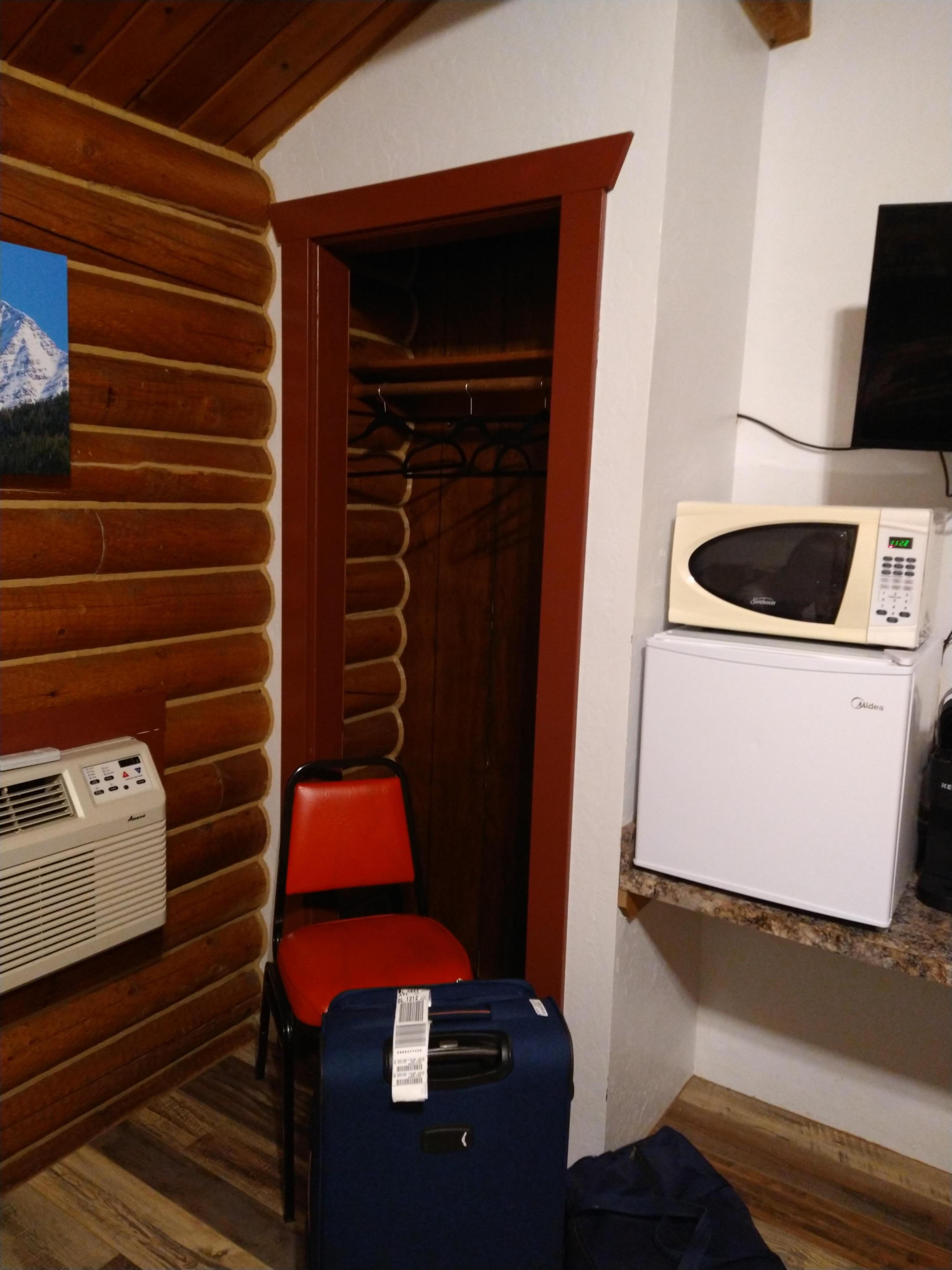 Fridge, microwave and closet.