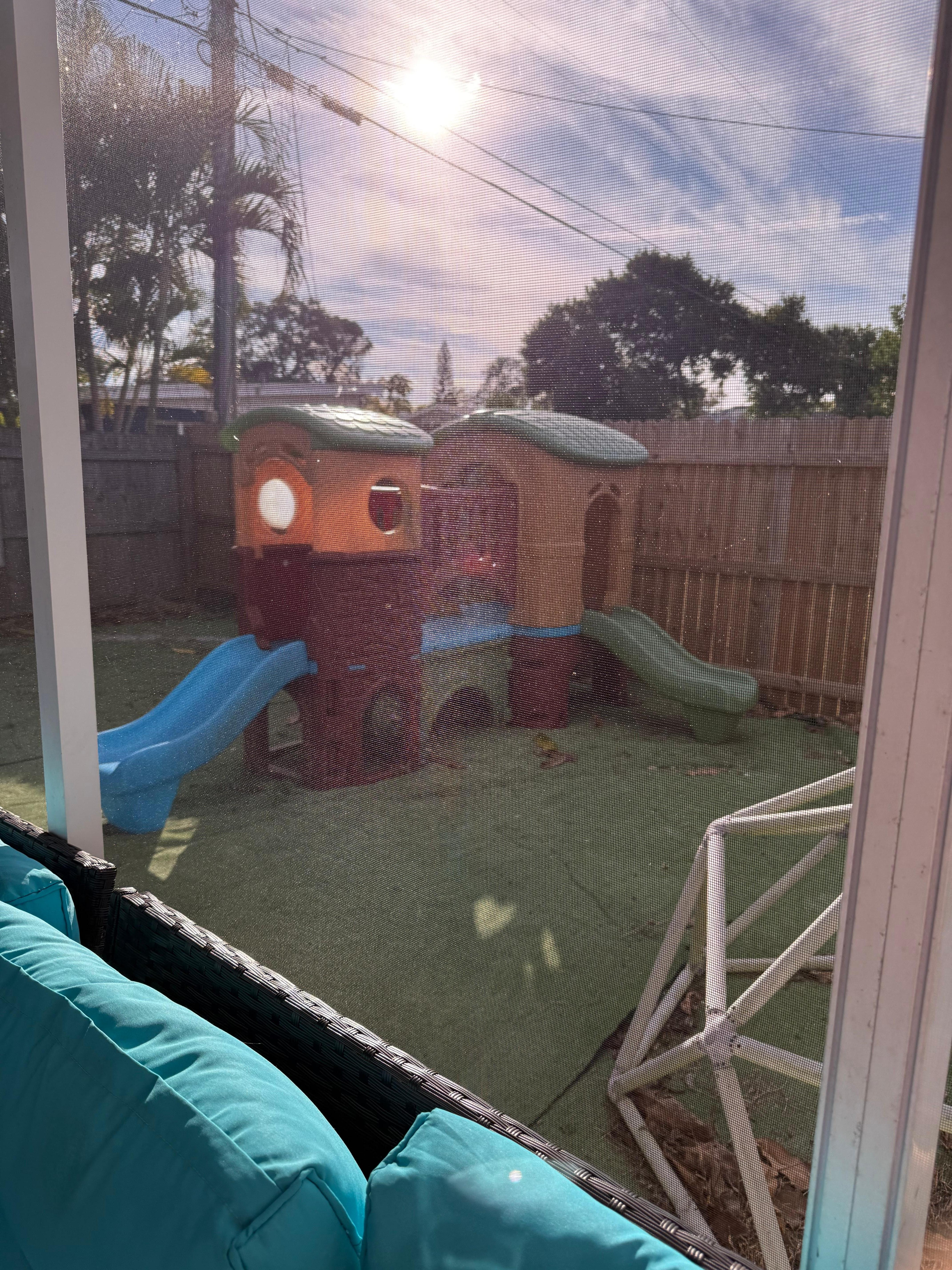 Backyard behind screened porch