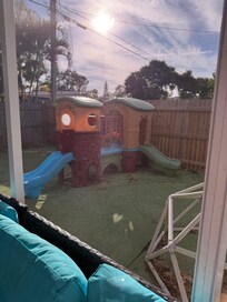 Backyard behind screened porch