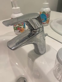 Dirty faucets. All of the faucets, sinks, toilets, and counters were in this condition.