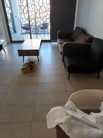 Dirty floor in front of the couch