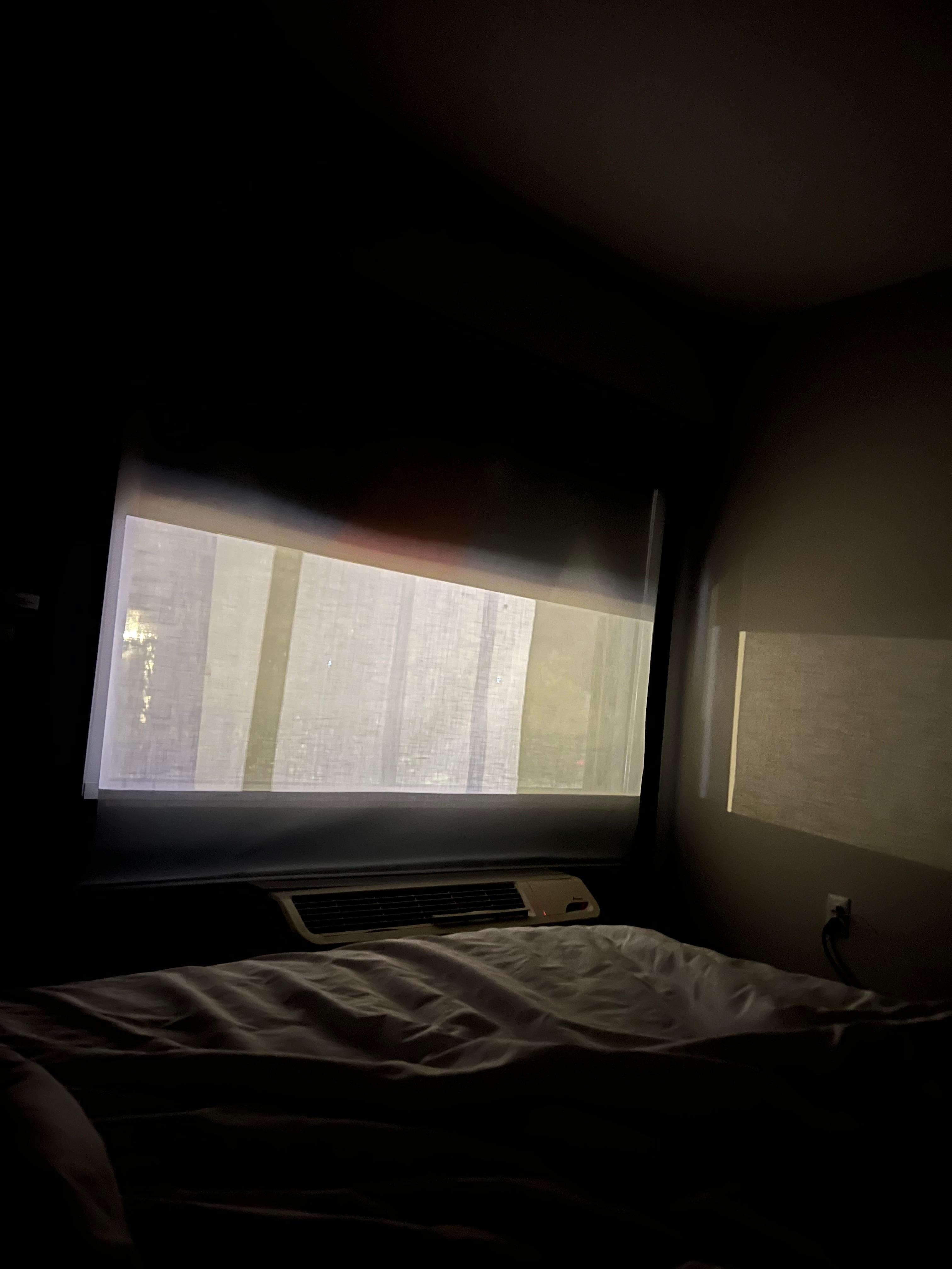 The shade was broken and wouldn't go all the way down.  i could see all of the lights at night.  