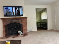 A fireplace supported by rock.