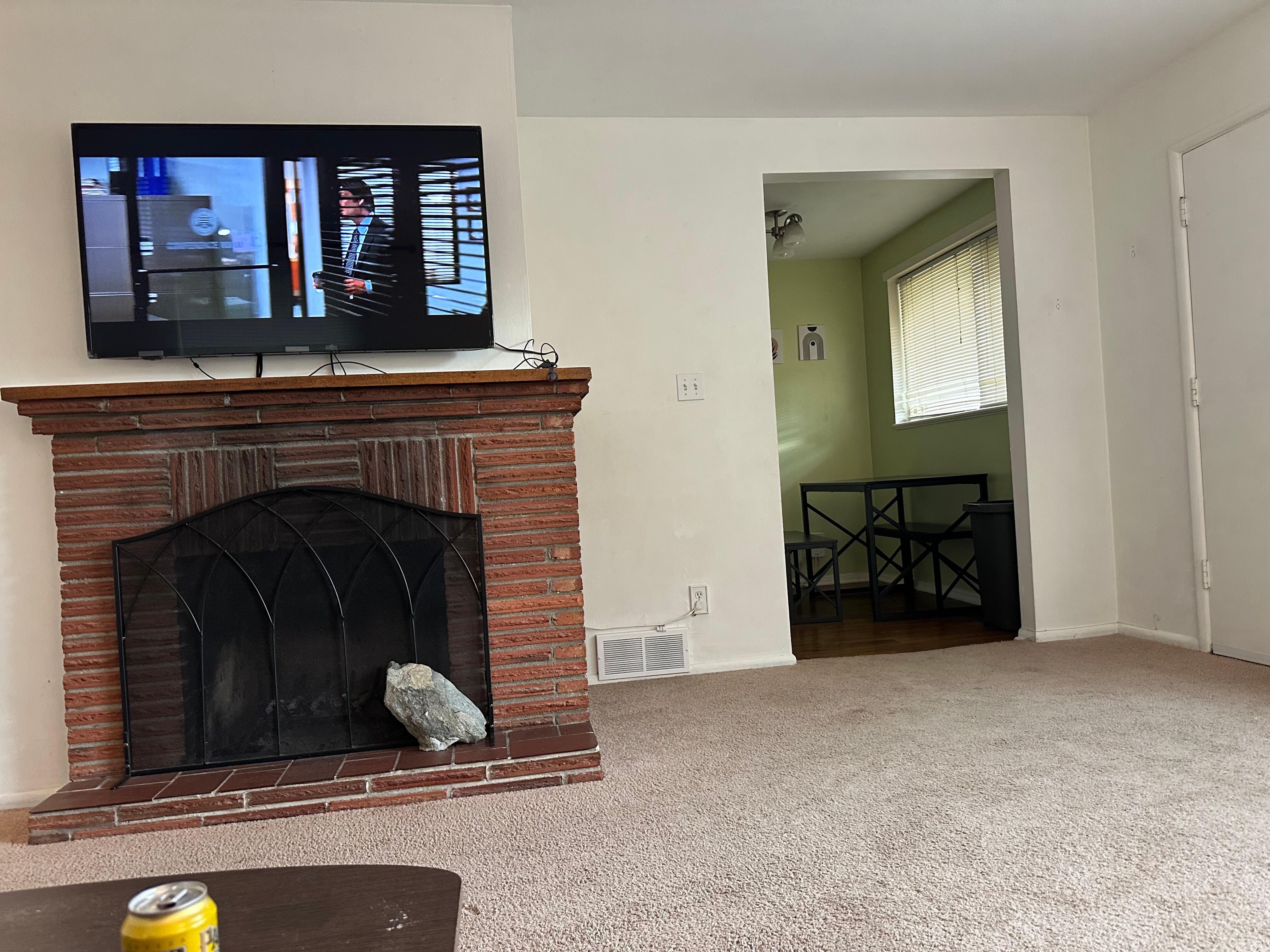A fireplace supported by rock.