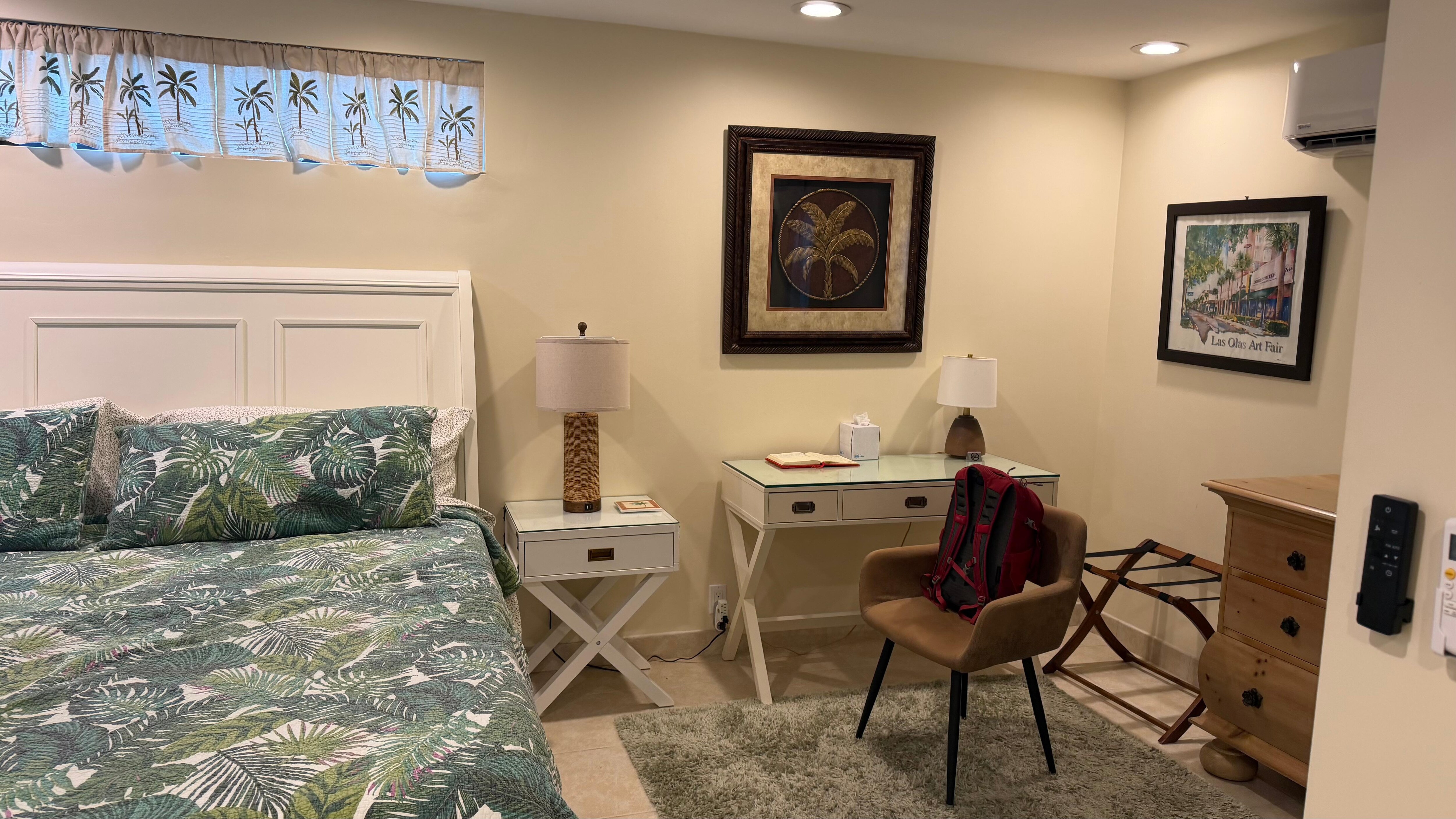 Lots of space in bedroom with dresser and writing desk and a large closet. 