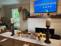 Farm style seating for 10. 4 chairs on one side, bench for 4 on opposite side, one chair at each end.