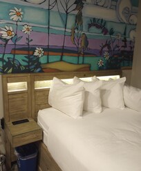 The bed is easy to access from one side, but the other side is very close to the wall.