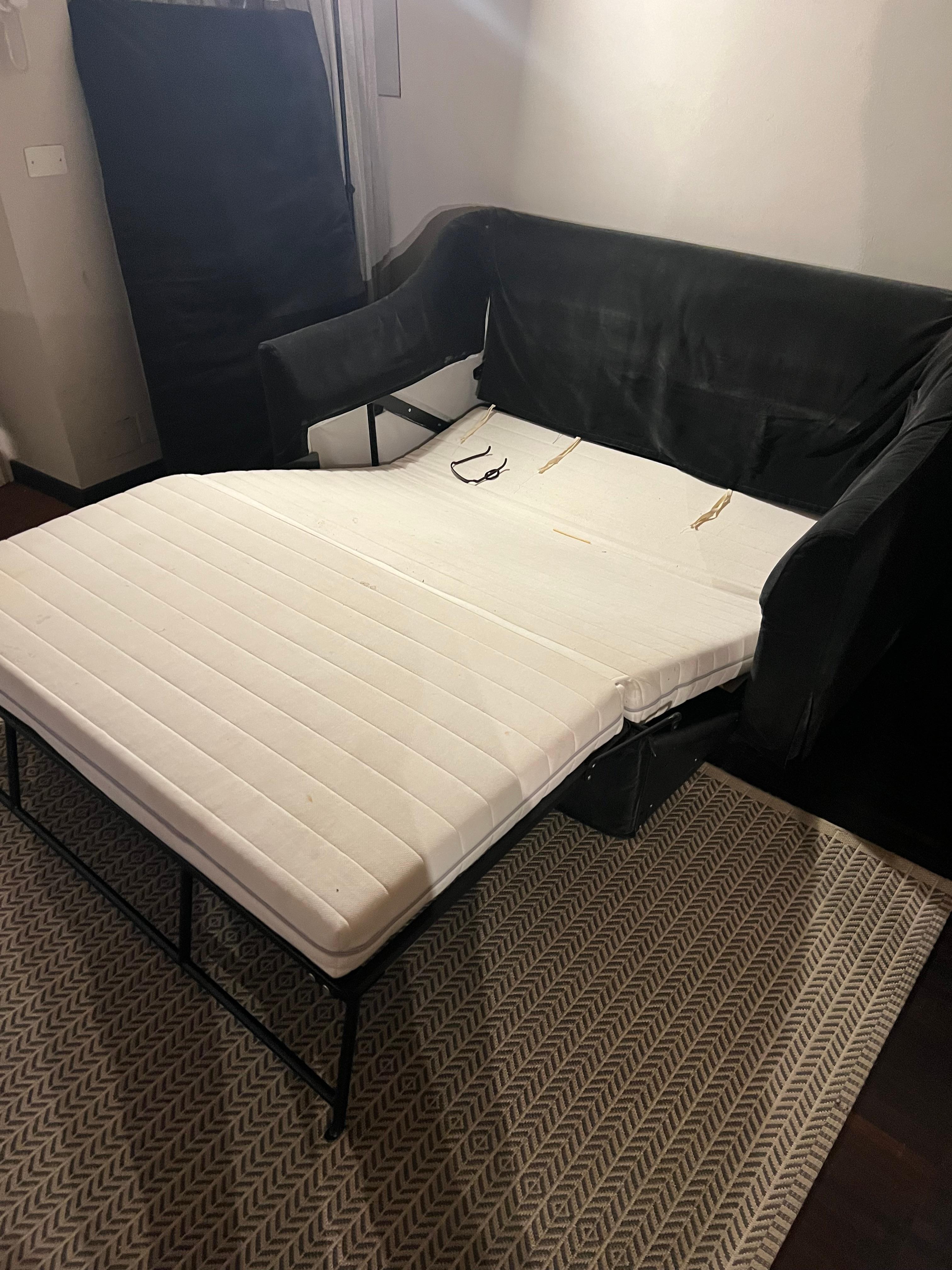 The sofa sleeper was broken and unusable, and it contained leftover hair, debris, and what appeared to be old clothing, indicating it had not been properly cleaned or prepared for guests.