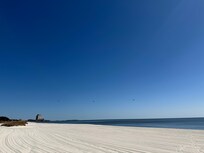 Beach is scraped every day to be clean and free from debris.