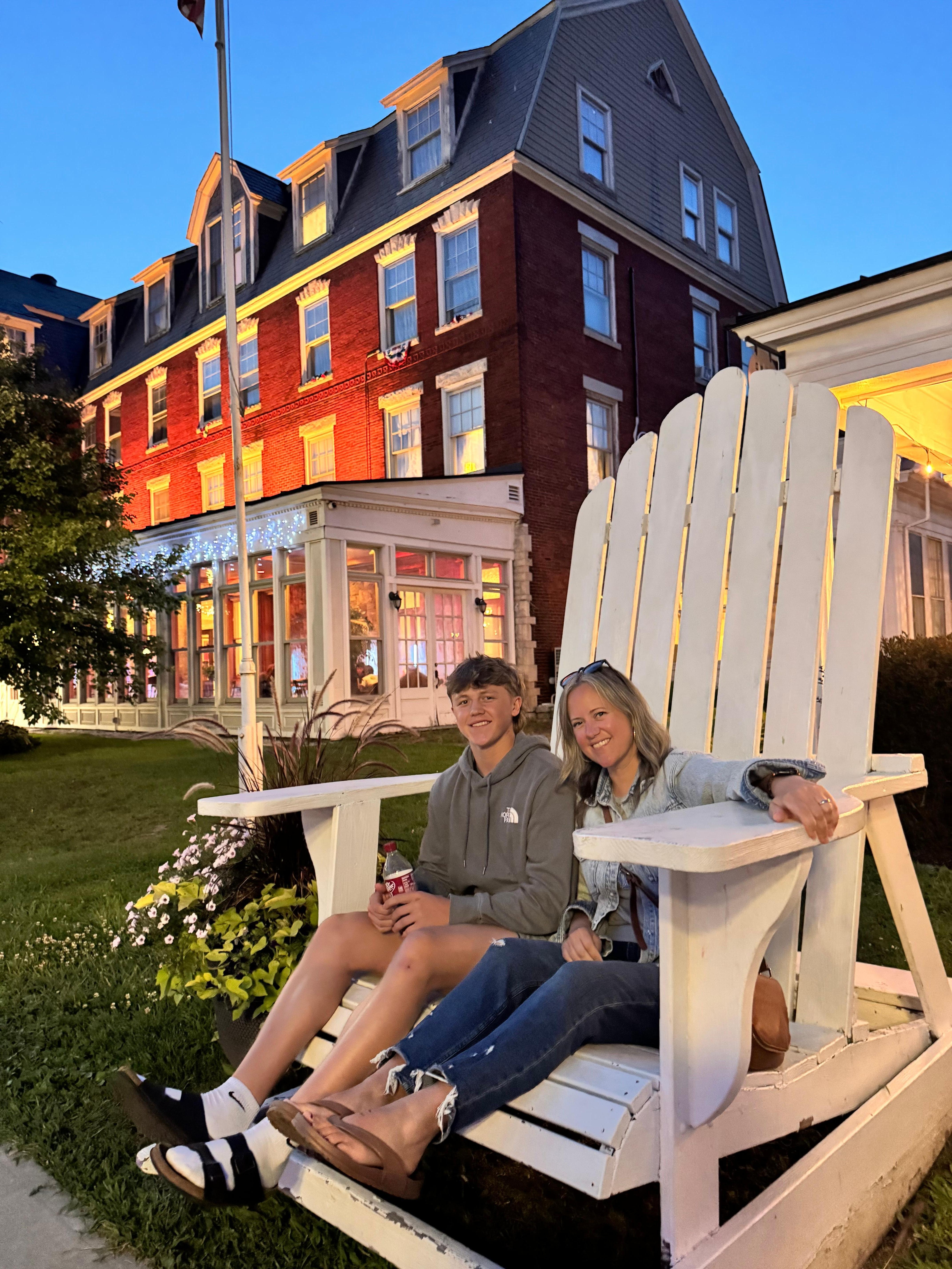 Sitting in front of the Brandon Inn all lit up at night.