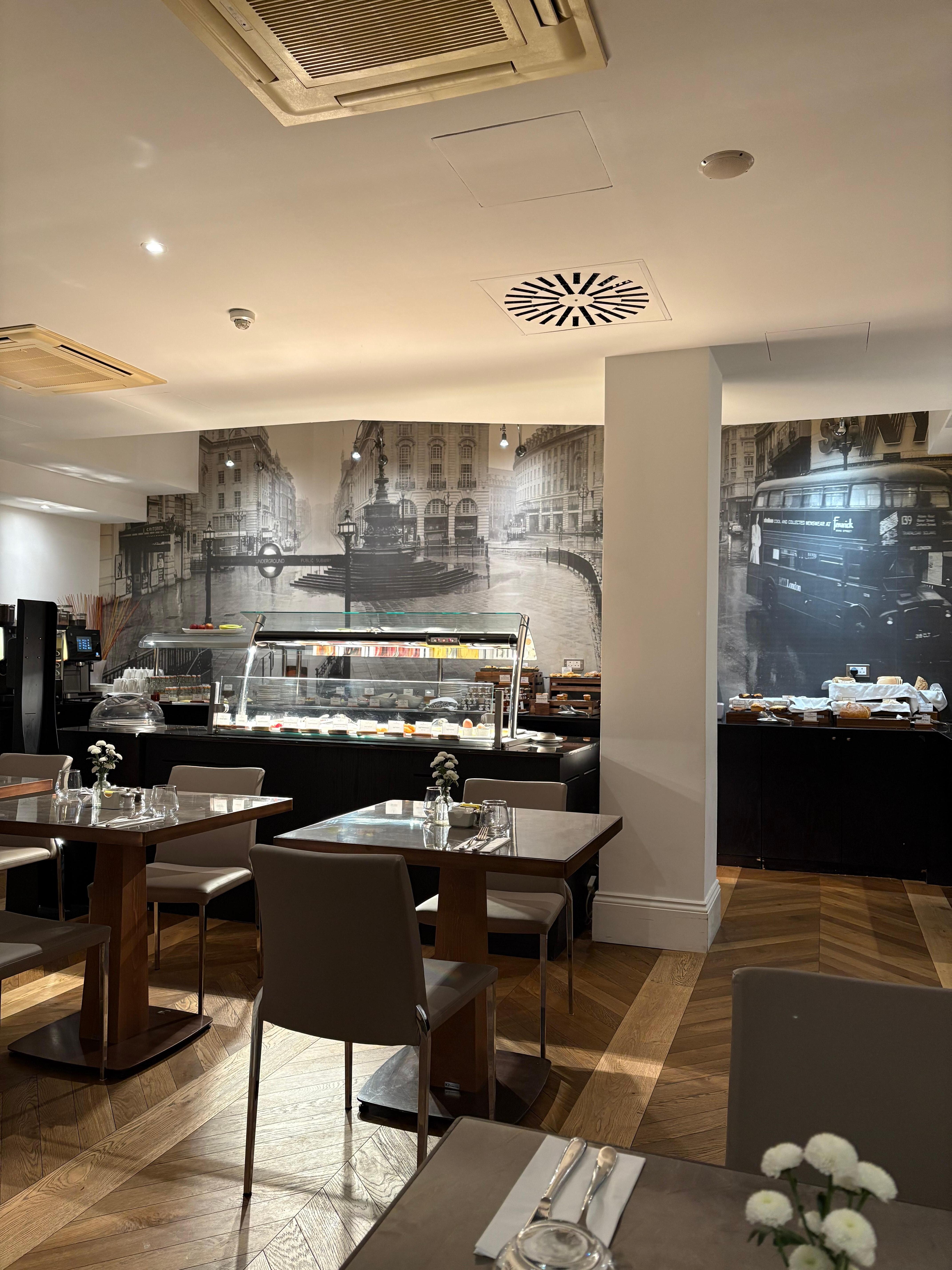 Buffet in the rear of the breakfast room on floor -1.   The  vintage and atmospheric photo of Piccadilly Circus is plastered like a fresco over the entire back wall and more than makes up for lack of view.