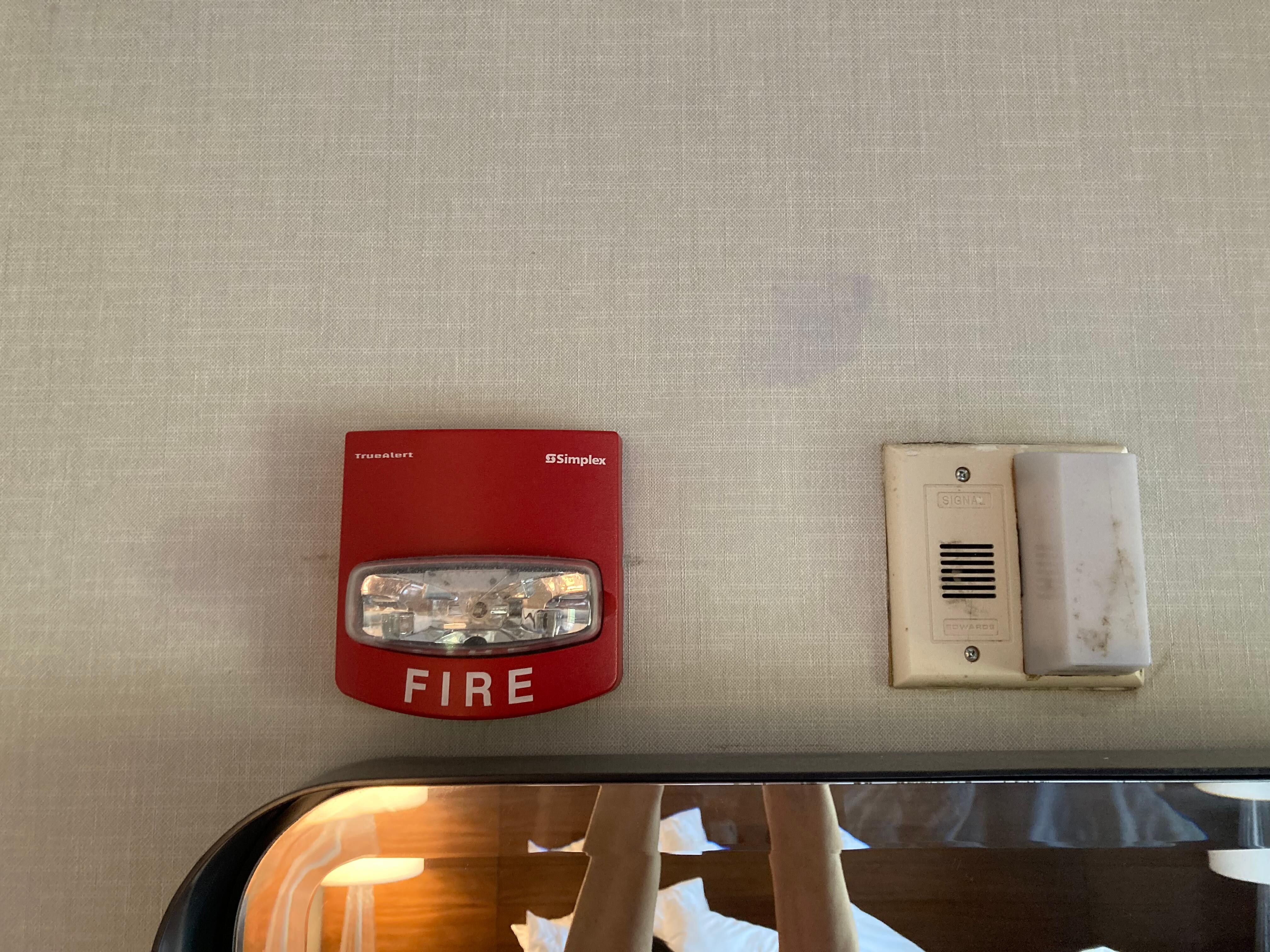Living room above TV. inside red fire box & all around & inside white box. 