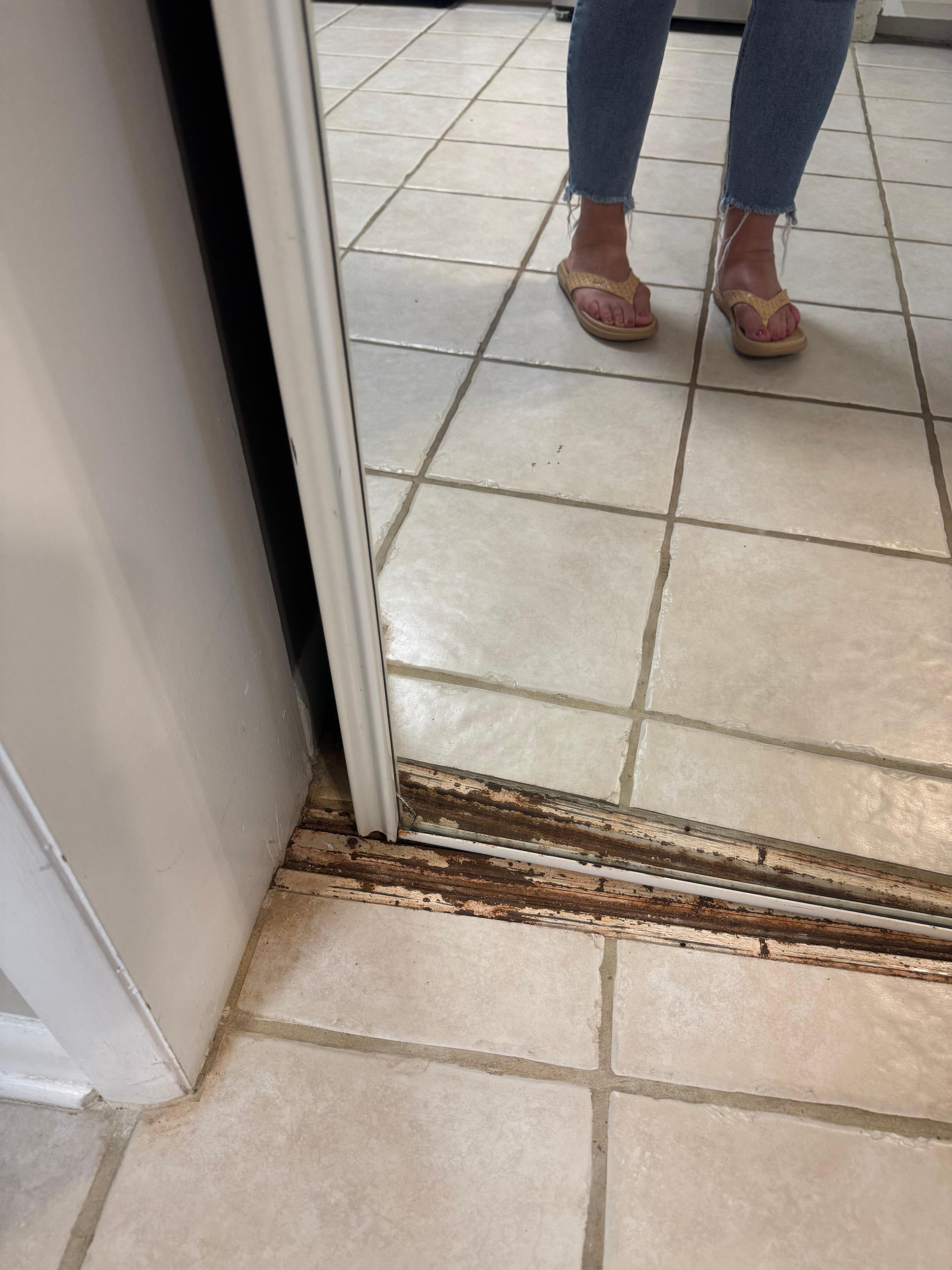 Not sure what is behind this rusted out broken mirrored door(?)