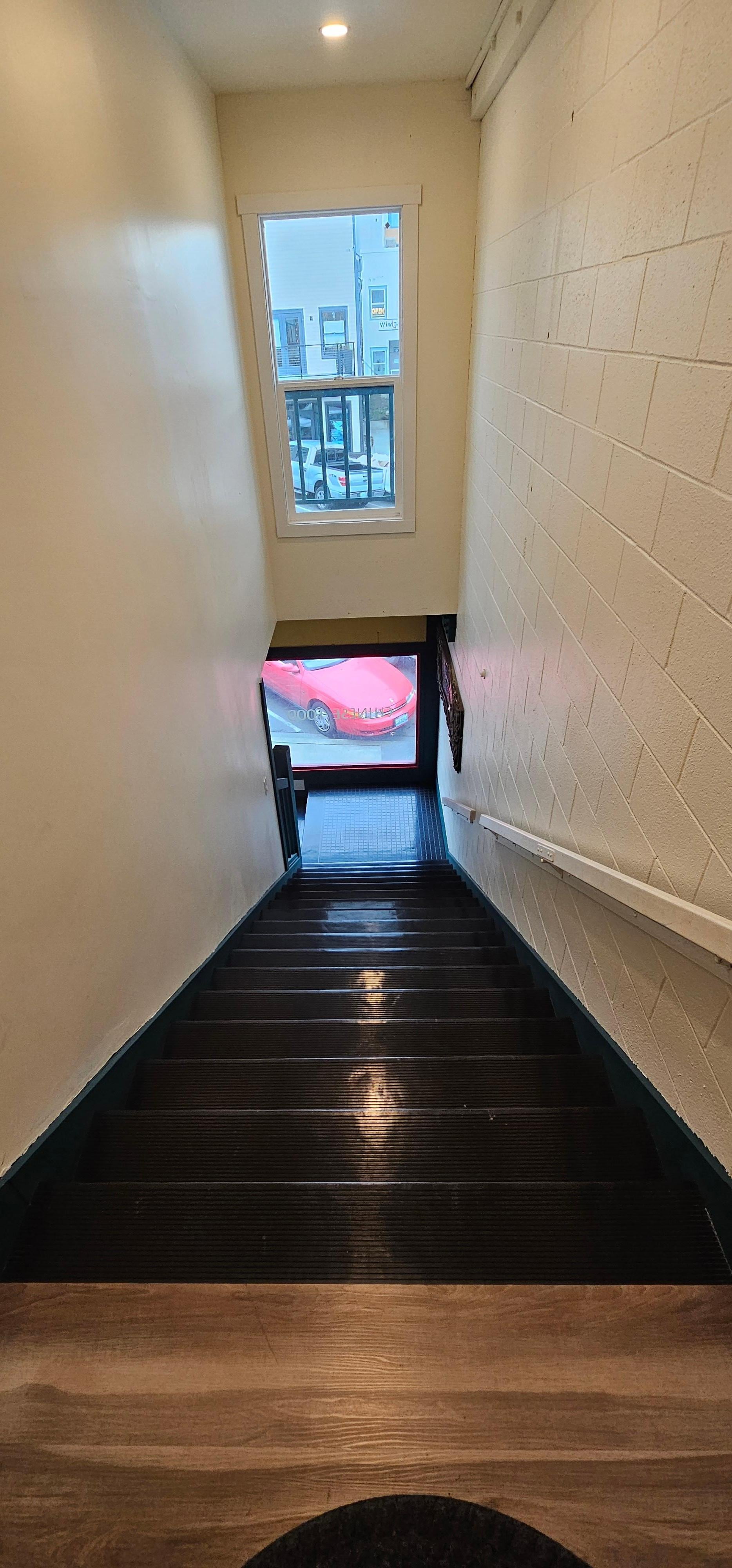15 stairs up to the rooms, to a secured door with keypad entry
