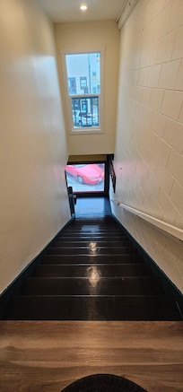 15 stairs up to the rooms, to a secured door with keypad entry