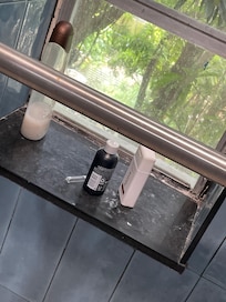 Razor cover and bath products left in shower.