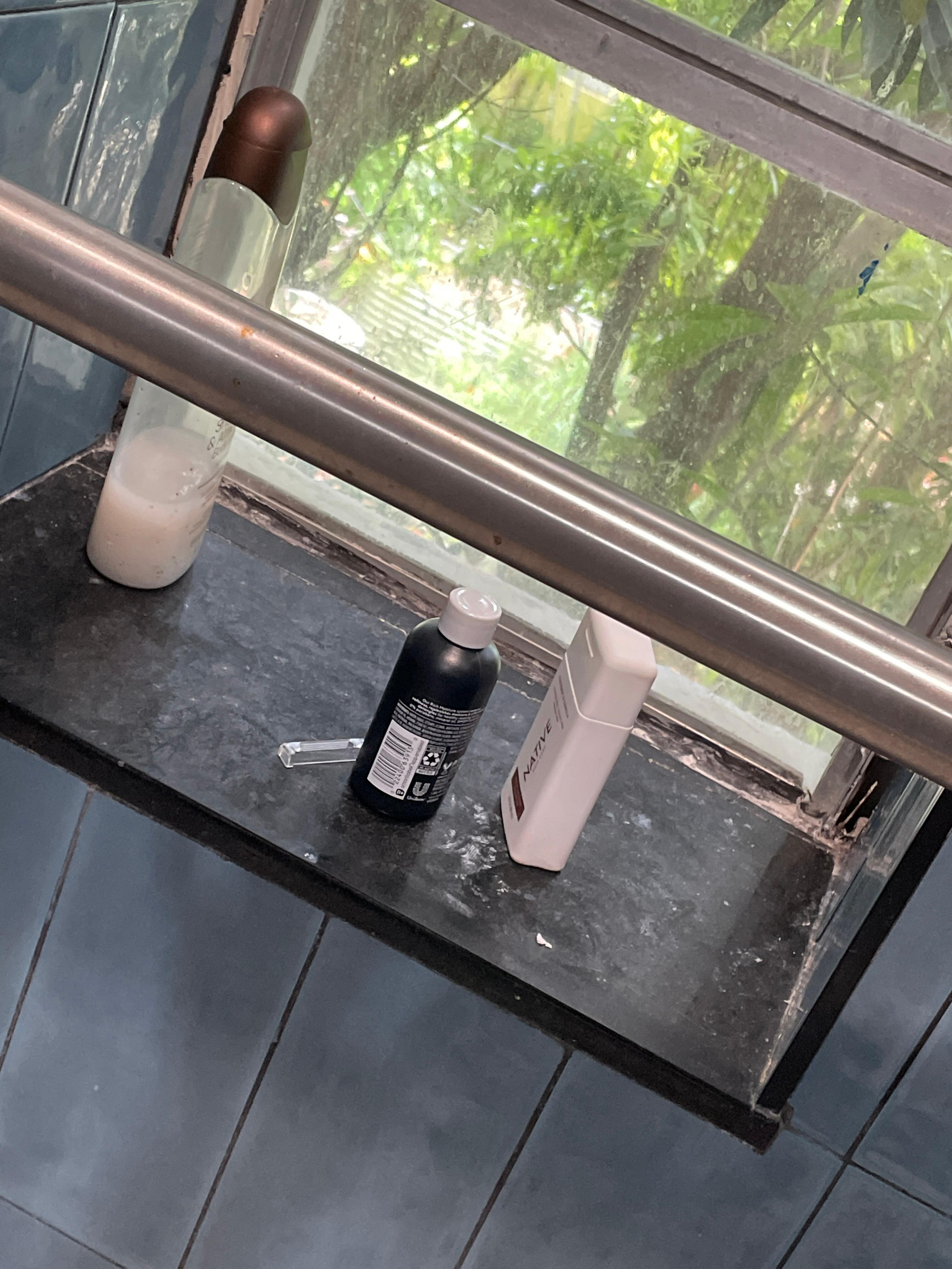 Razor cover and bath products left in shower. 