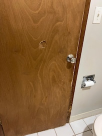Door was all acratched with a hole punched in it
