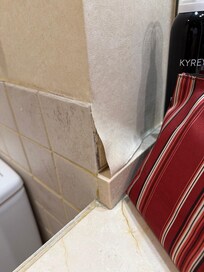 Wallpaper in bathroom coming off
