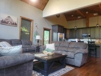 The living/dining area had high ceilings, comfortable seating, and a fully stocked kitchen.