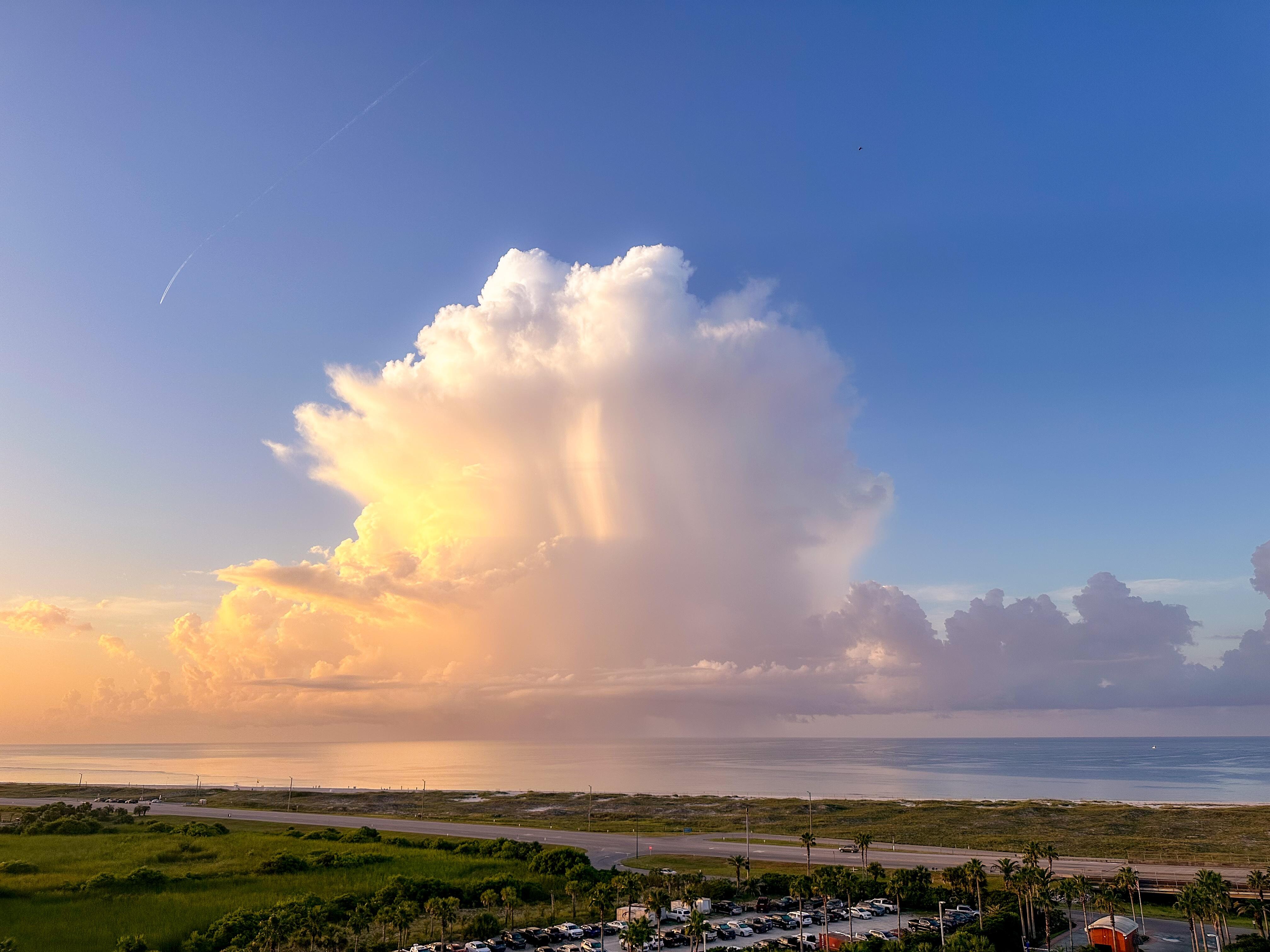 Thunderhead several miles offshore at sunrise. 