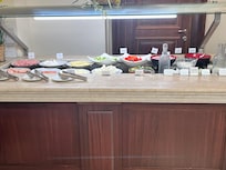 Buffet breakfast -1. Cheeses. Meat. Yogurt. Salad plus more.