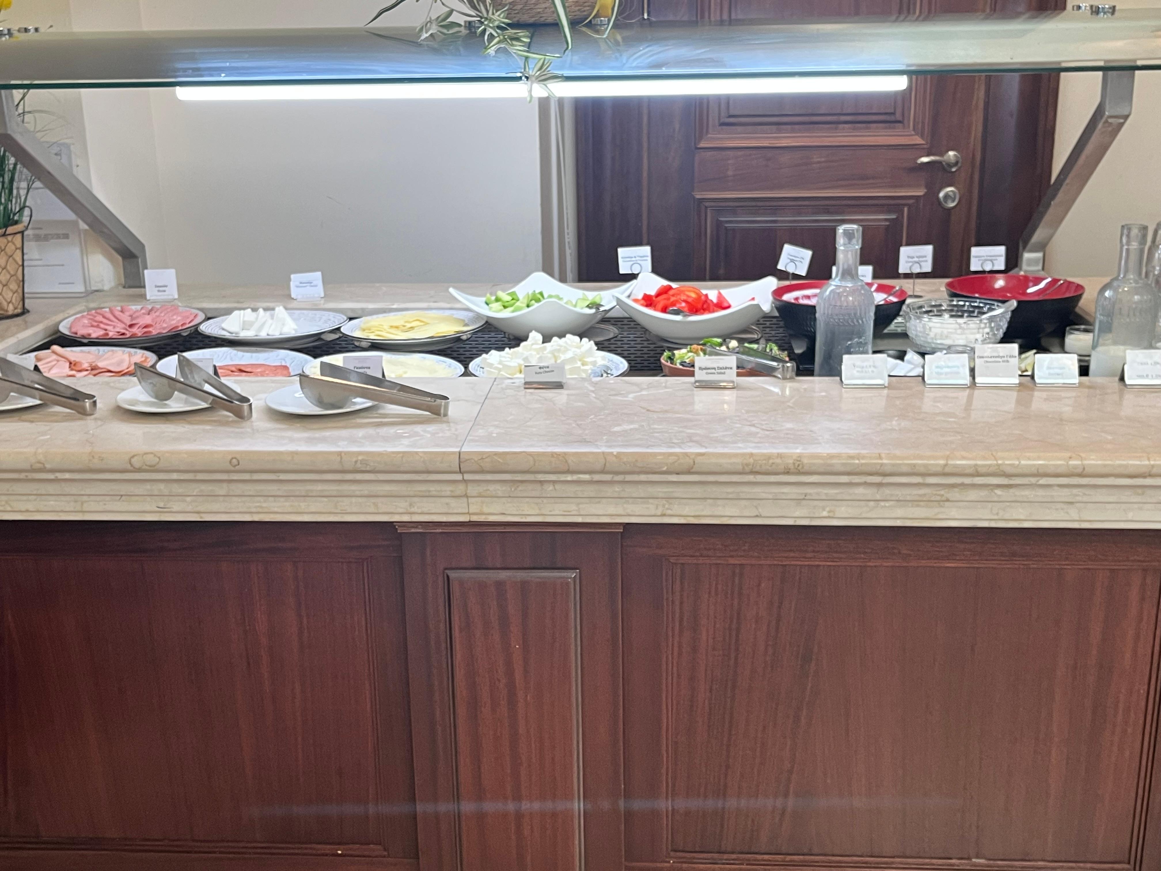 Buffet breakfast -1. Cheeses. Meat. Yogurt. Salad plus more.